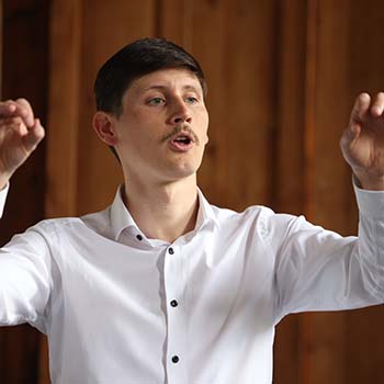 Brian Dungan performing in the Choral Conducting competition